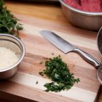 kitchen, cooking, knife, cilantro, mixing bowl, strainer bowl, strainer, kitchenware, parmesan, shredded cheese, shredded parmesan, cutting board, wood cutting board, kitchen, kitchen, kitchen, kitchen, cooking, cooking, cooking, cooking, cooking, knife, cutting board
